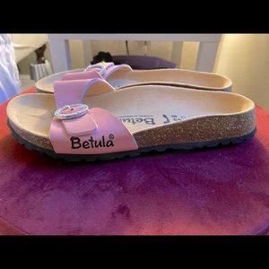 Pink sandals with diamanté buckle.